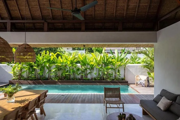 Open tropical living room facing the private pool